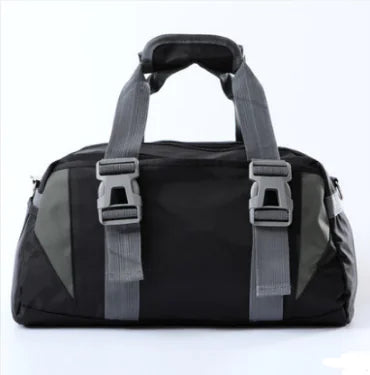 Black duffel bag with gray straps on a white background, from ghg global powerhouse.