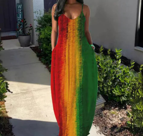 Person wearing a colorful dress with red, orange, and green gradient in an outdoor setting. From ghg wellness shop.