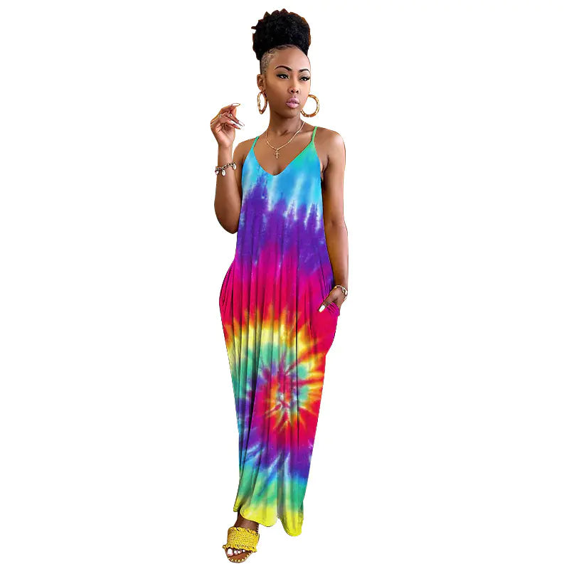 Woman wearing a colorful tie-dye dress on a white background. From ghg wellness shop.