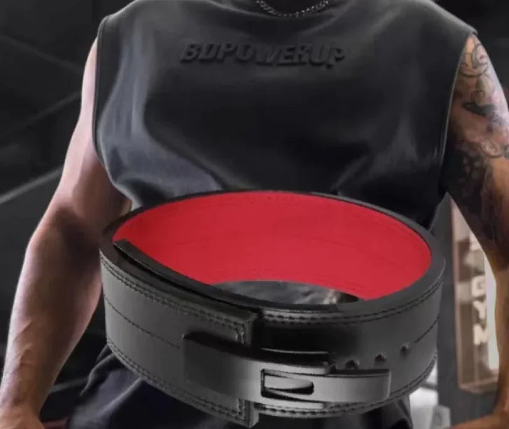 Person wearing a black weightlifting belt with red interior, from ghg global powerhouse.
