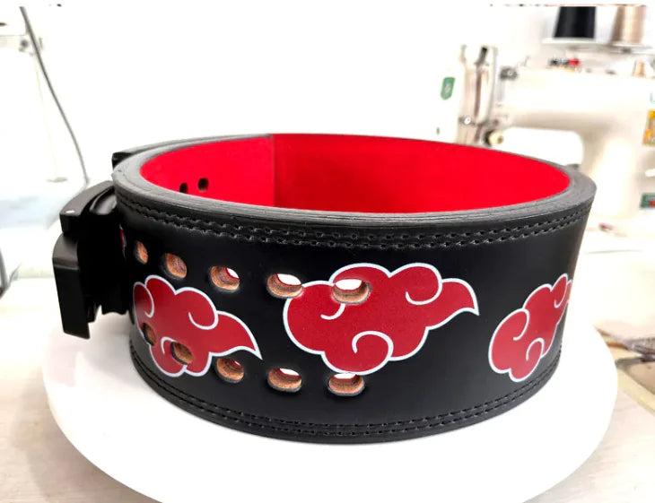 Black leather belt with red cloud designs on a white background, from ghg global powerhouse.