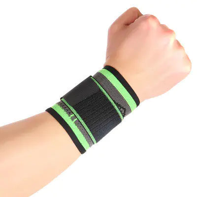Black and green wrist support brace on a wrist against a white background, from ghg global powerhouse.